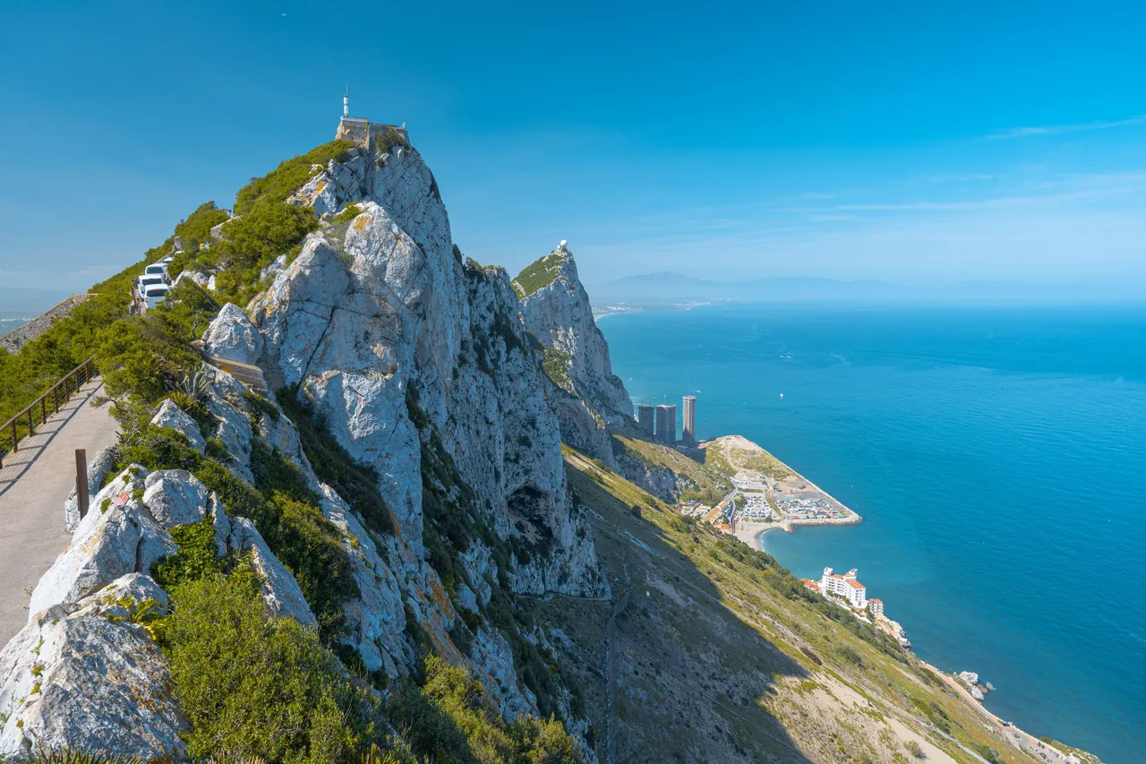 The Upper Rock of Gibraltar above the Mediterranean under a clear blue sky